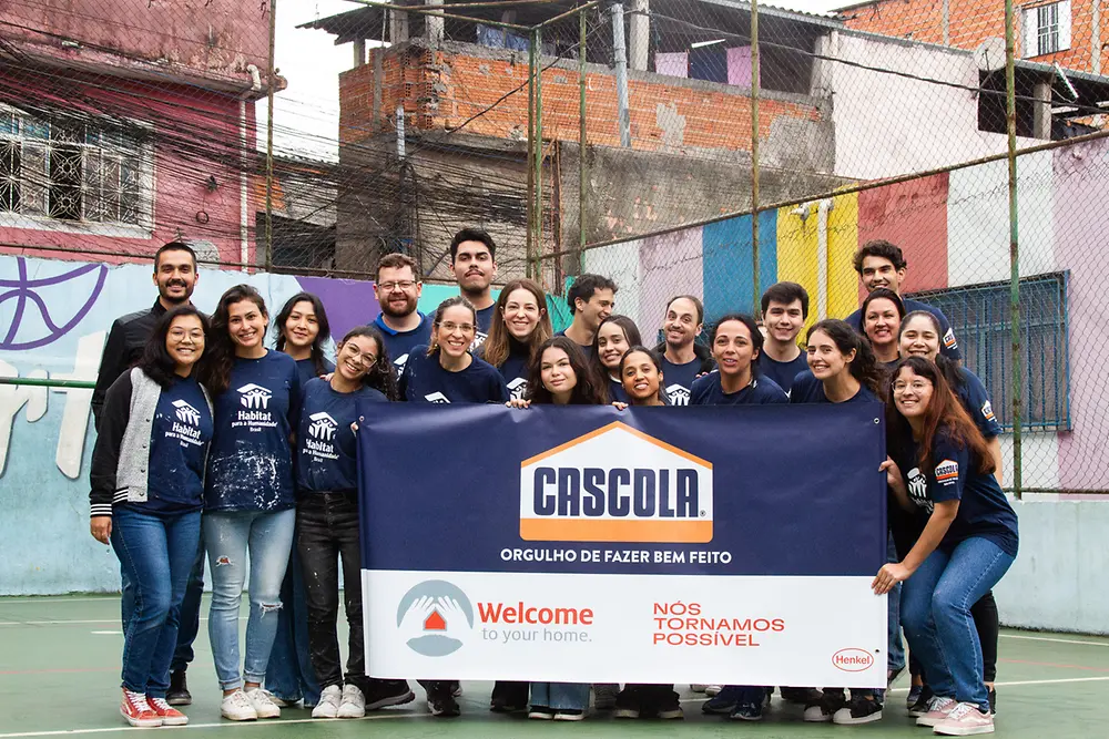 Voluntários participantes da ação Welcome Home 2024 da Cascola na comunidade de Heliópolis-SP